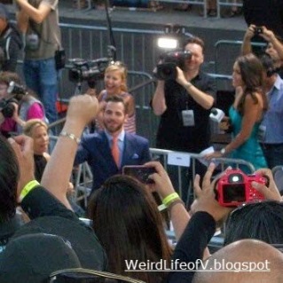 Chris Pine waving to the fans in the bleachers 